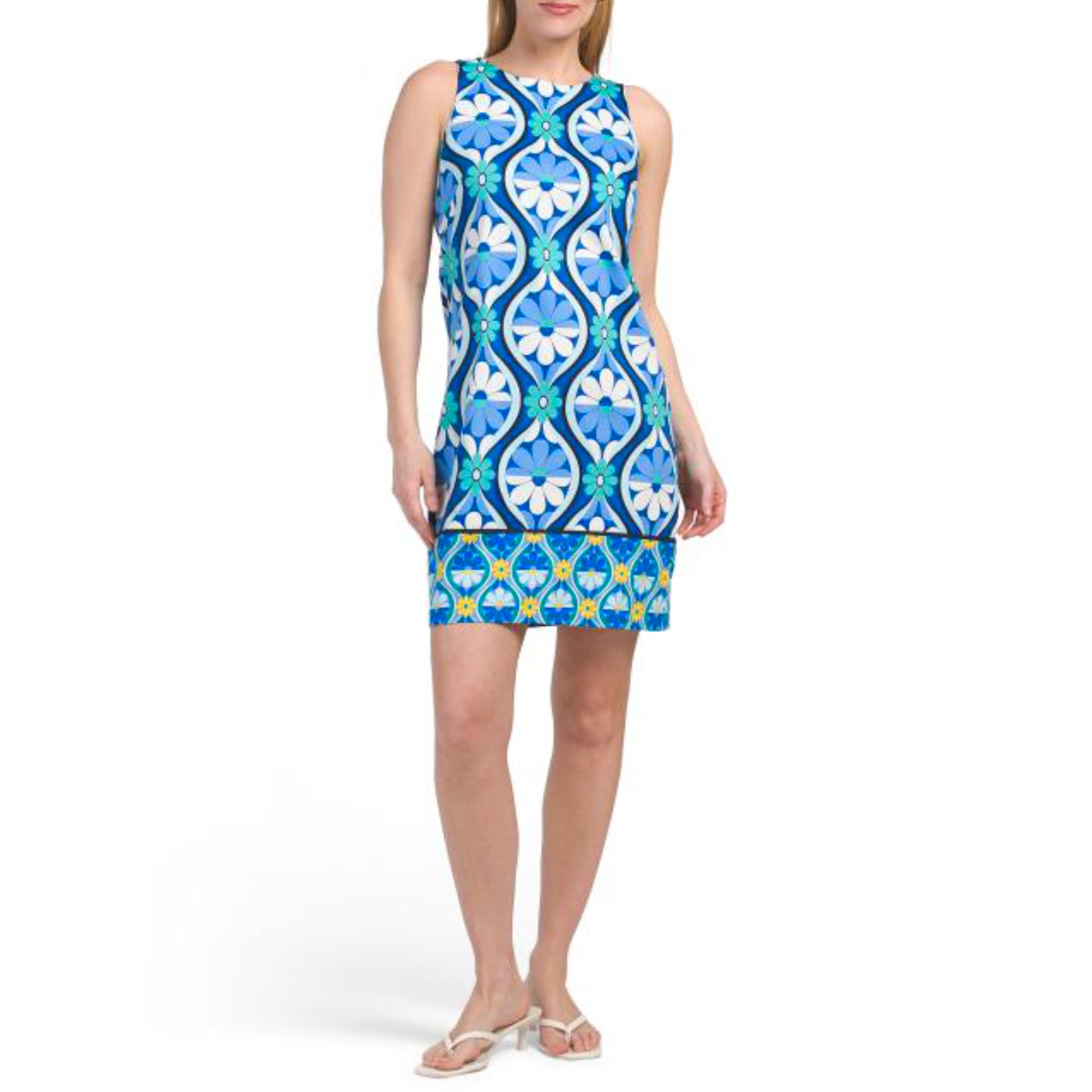 Effortless elegance meets everyday comfort in this London Times mini shift dress. Featuring a vibrant floral print on a soft cotton-spandex blend, this sleeveless design offers gentle stretch for all-day wear. The classic round neckline and contrast hem create a polished look, while the back zip closure ensures a secure fit. At approximately 36 inches long, it's the perfect length for a modern, playful silhouette.&nbsp;