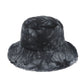 Elevate your summer style with this Vince Camuto tie-dye bucket hat. Crafted from 100% cotton with a trendy raw edge finish, it features eye-catching tie-dye patterns that make a bold fashion statement. The 3.5" brim provides practical sun protection while keeping you looking effortlessly cool. Available in Sienna and Black, this versatile hat pairs seamlessly with any warm-weather outfit. Perfect for beach days, outdoor adventures, or casual everyday wear.
